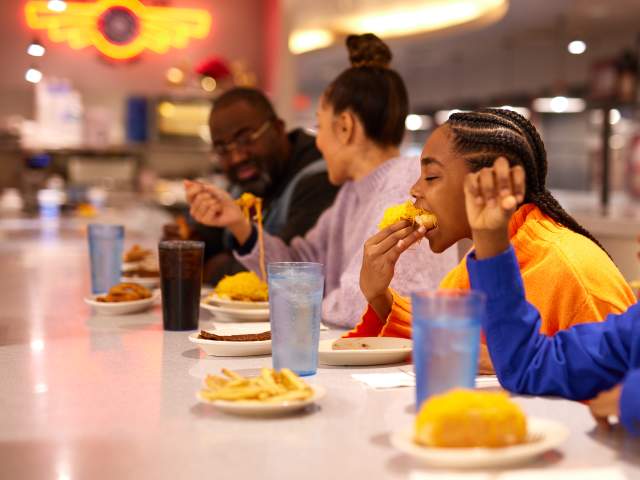 A family enjoys Cincinnati chili at Camp Washington Chili Parlor