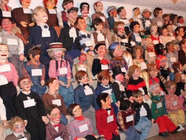 A wall of ventriloquist dummies at Vent Haven Museum