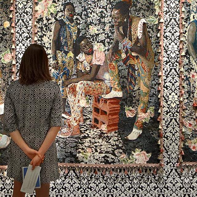 Person viewing a tapestry