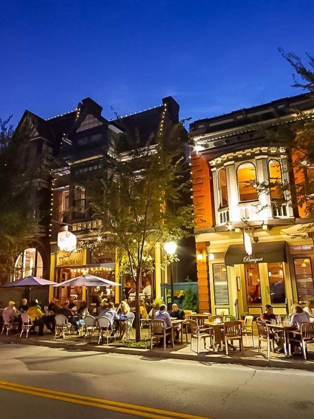 19th century buildings in Mainstrasse Village in Covington, Ky. illuminated by strings of lights and street lights.