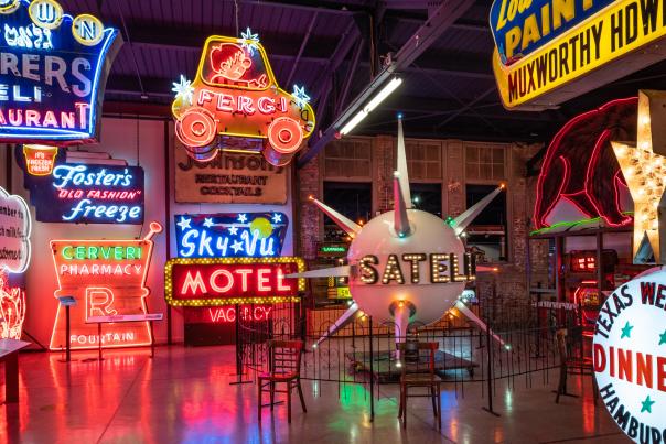 Several neon signs on display at the American Sign Museum