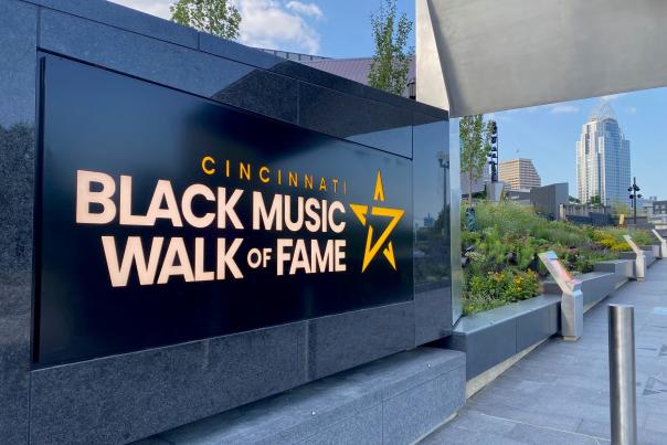 A black marble sign that says Cincinnati Black Music Walk of Fame