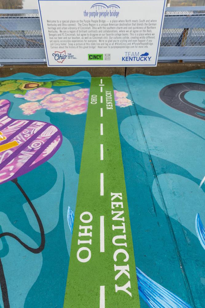 Close up of mural that marks where Ohio and Kentucky state lines meet on the Purple People Bridge