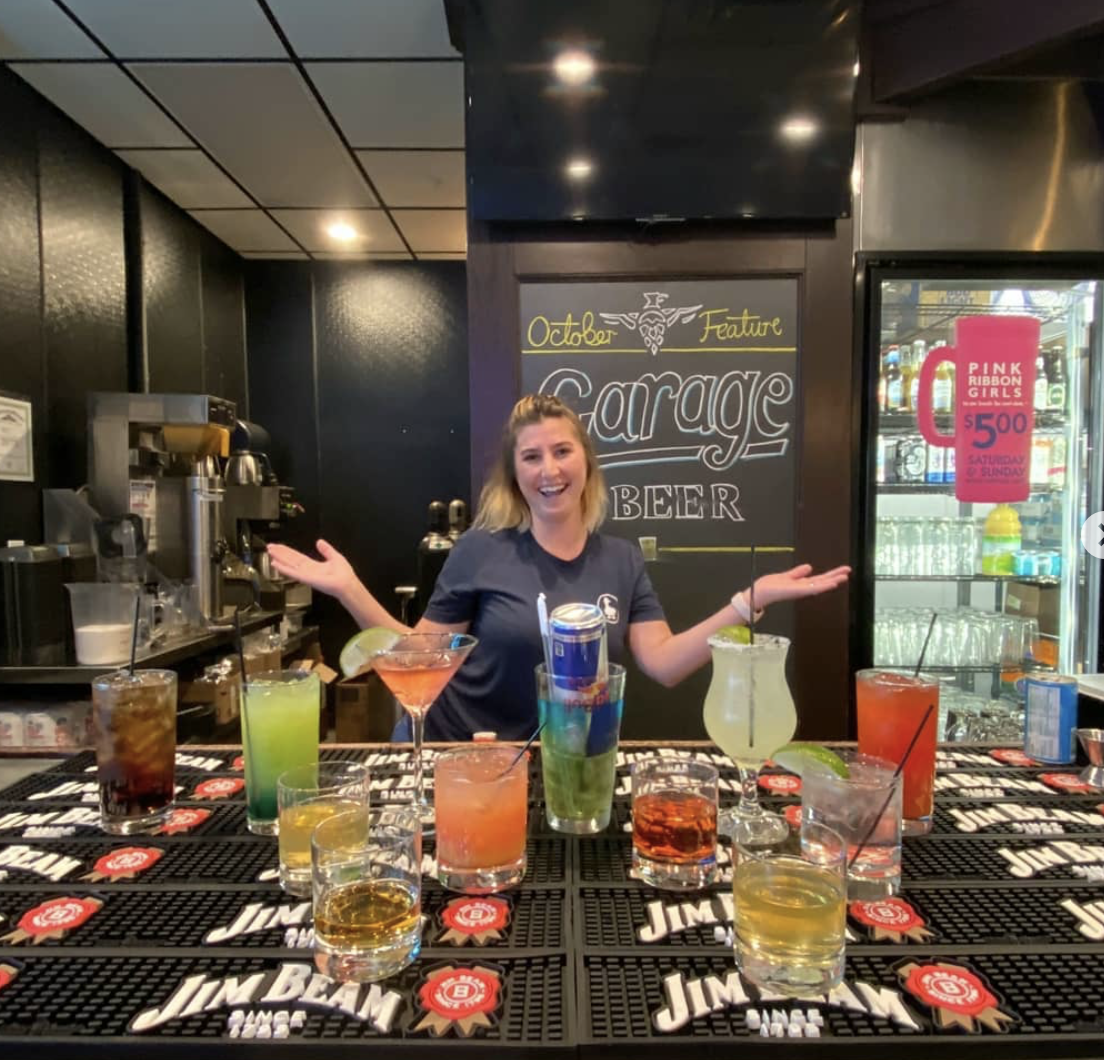 bartender and multiple cocktails at lucky duck pub in burlington ky