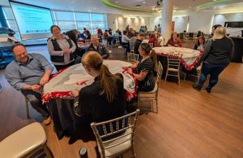 Groups of volunteers helping at a voluntourism event at the Newport Aquarium.