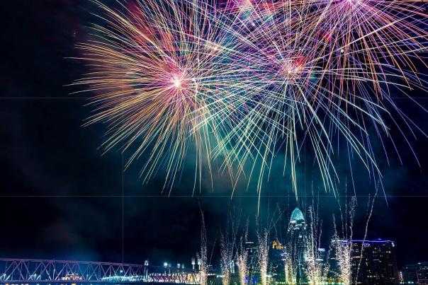Image is of fireworks over the Ohio River with the City of Cincinnati in the background.