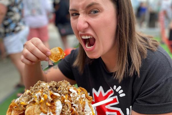 Glier's Goettafest Girl Eating Nachos Crop
