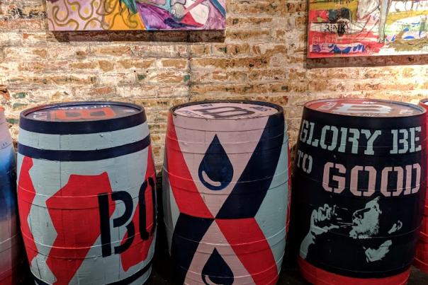 Three art painted bourbon barrels feature artwork for The B-Line in Northern Kentucky