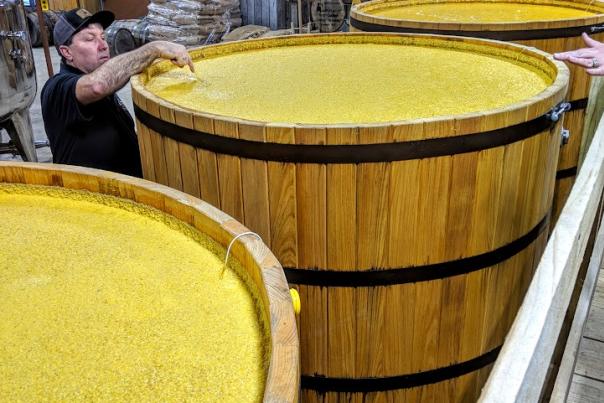 Three mash tubs full of golden moonshine and bourbon mash at the Neeley Family Distillery on The B-Line in NKY