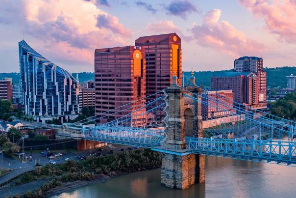 The skyscrapers, The Ascent and Rivercenter Towers behind the Roebling Bridge and Ohio river on a sunny day