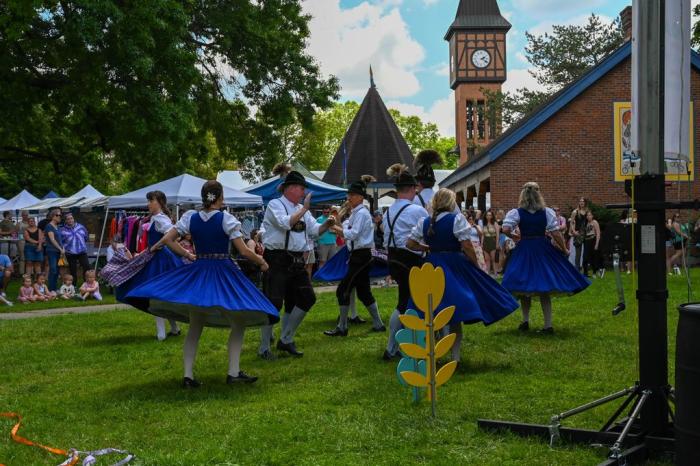 A group of dancers perform at Covington Maifest in Goebel Park