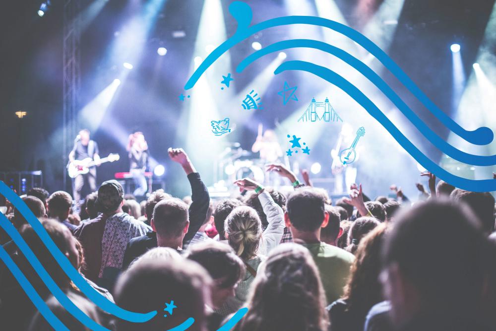A group of people face a lit stage. Hand drawn elements decorate the photo.