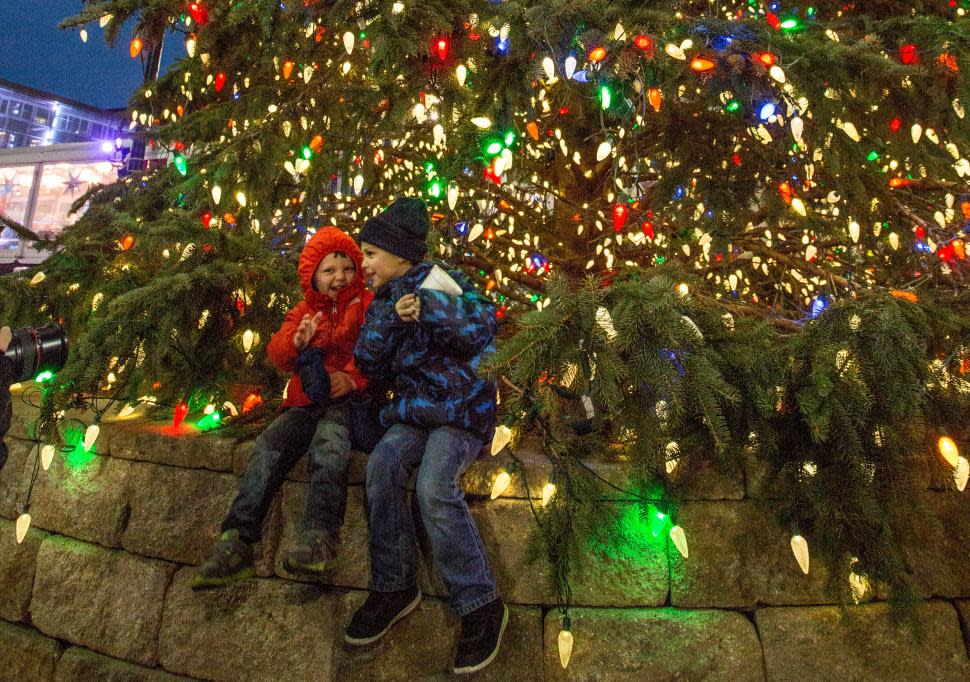 Kids enjoying the Fountain Square tree during the holidays
