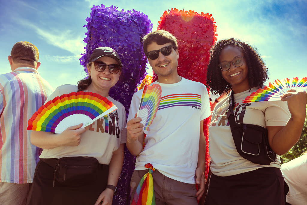Visit Cincy employees post on a pride parade float