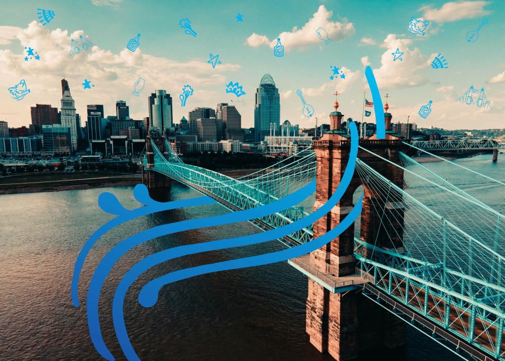 A view of the Roebling Bridge and Cincinnati Skyline with blue hand drawn elements.