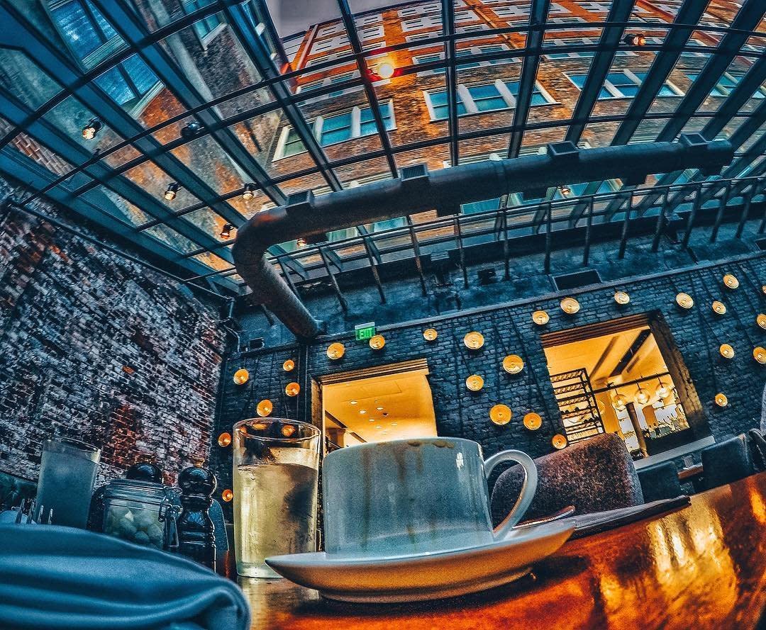 A coffee cup on a shiny table under the glass roof of Coppin's restaurant in the Hotel Covington in Northern Kentucky.