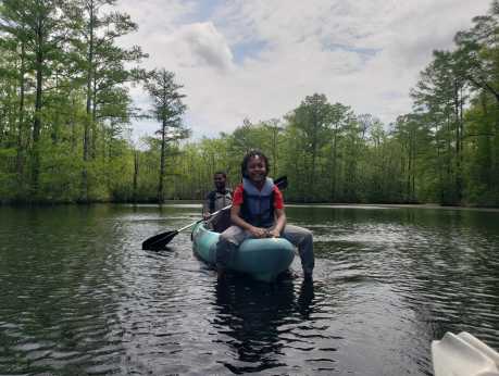 Child on End of Kayak with Father