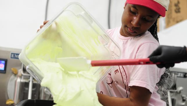 Worker Preparing Ice Cream at Sundae Scoop