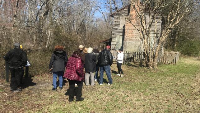 Visitors outside the Superintendent's House on the Dismal Swamp Canal in Chesapeake, VA