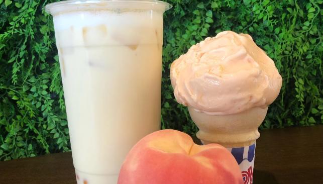 A drink, peach, and ice cream cone at Look Up Dessert Cafe