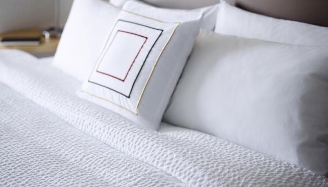 a bed inside Springhill suites hotel