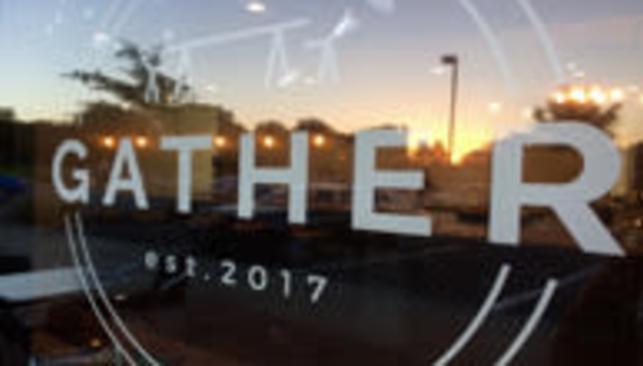 Gather Cafe logo in their storefront window