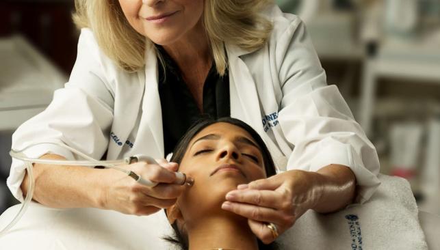 A customer being serviced at Hand & Stone Massage