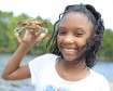 Girl with crab in the great outdoors