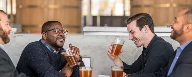 Group of men drinking beer at brewery in Columbia, SC
