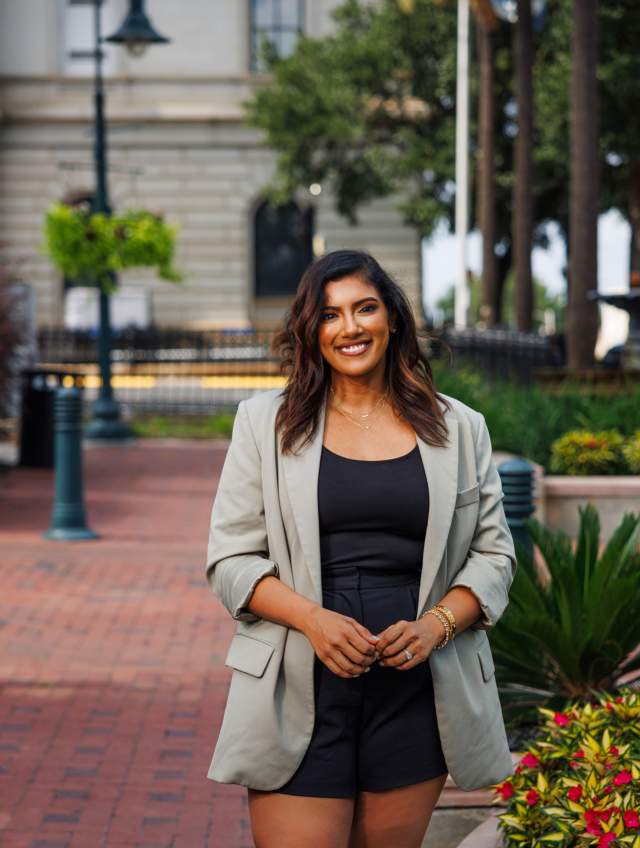 Woman standing on sidewalk