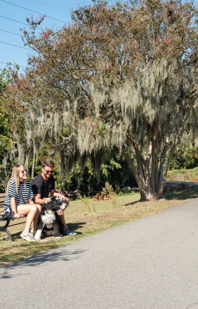 Couple Sitting On A Bench On The Three Rivers Greenway In Columbia, SC