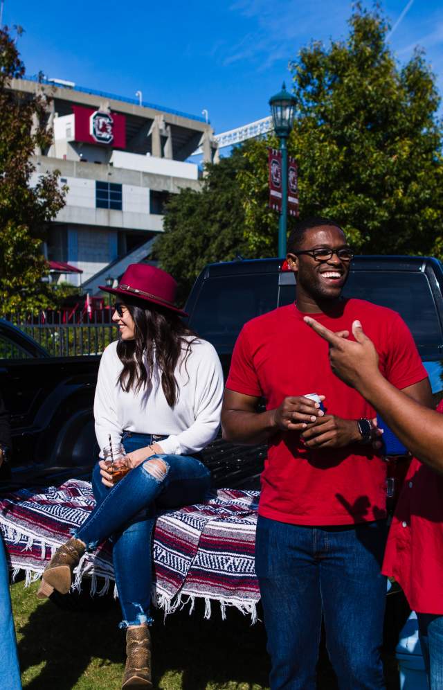 4 friends tailgating outside of Williams Brice Stadium