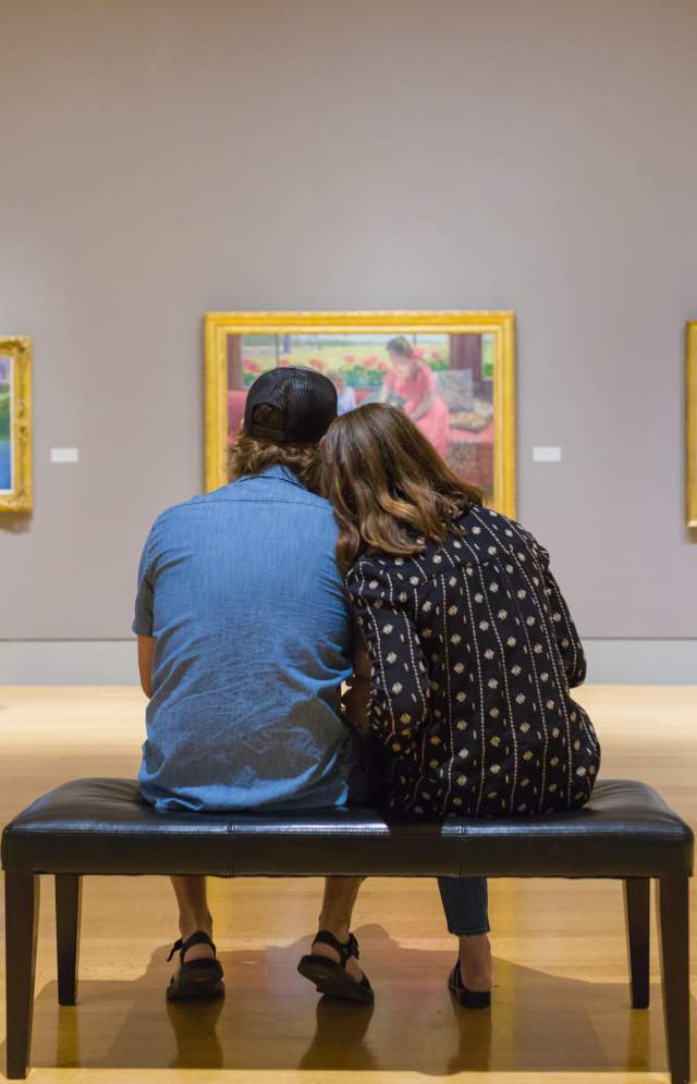 Visitors admire the artwork on display at the Columbia Museum of Art.