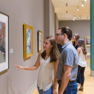 Couple enjoying artwork in a Columbia SC gallery