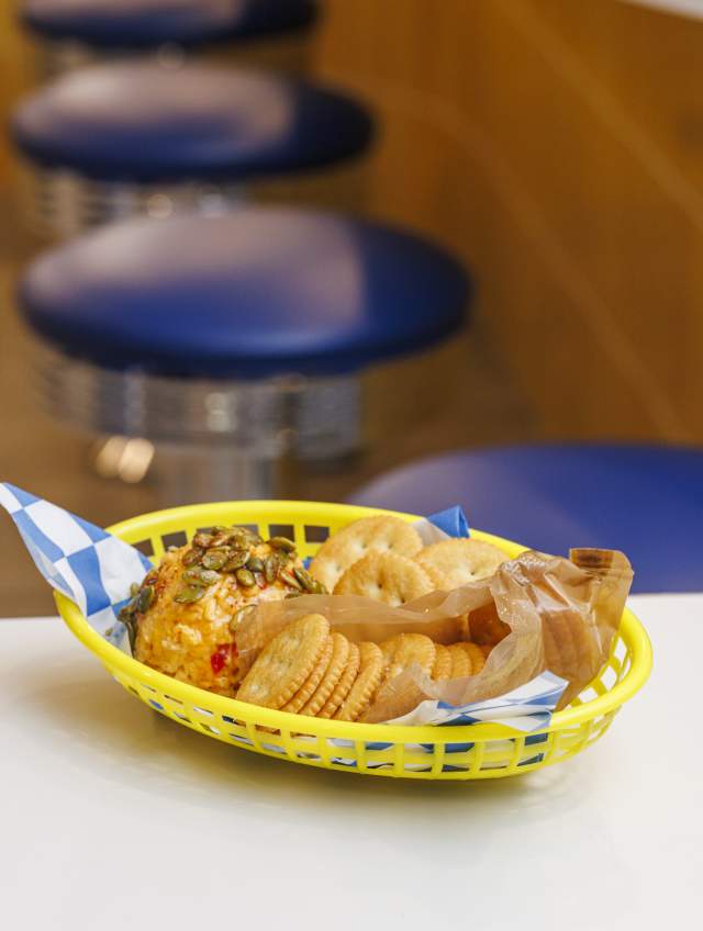 Basket of pimento cheese and a sleeve of Ritz crackers