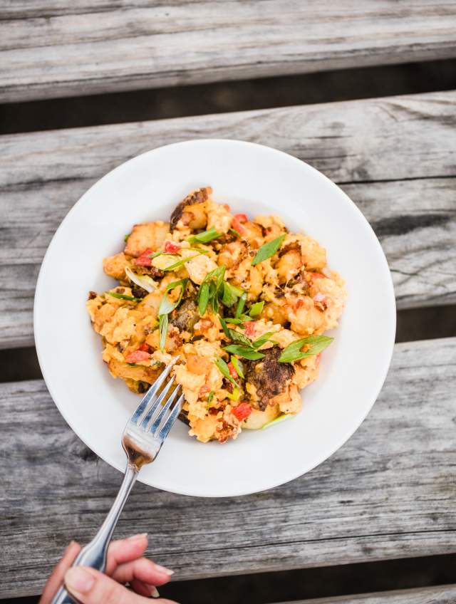 Smashed Potatoes topped with pimento cheese and green onions