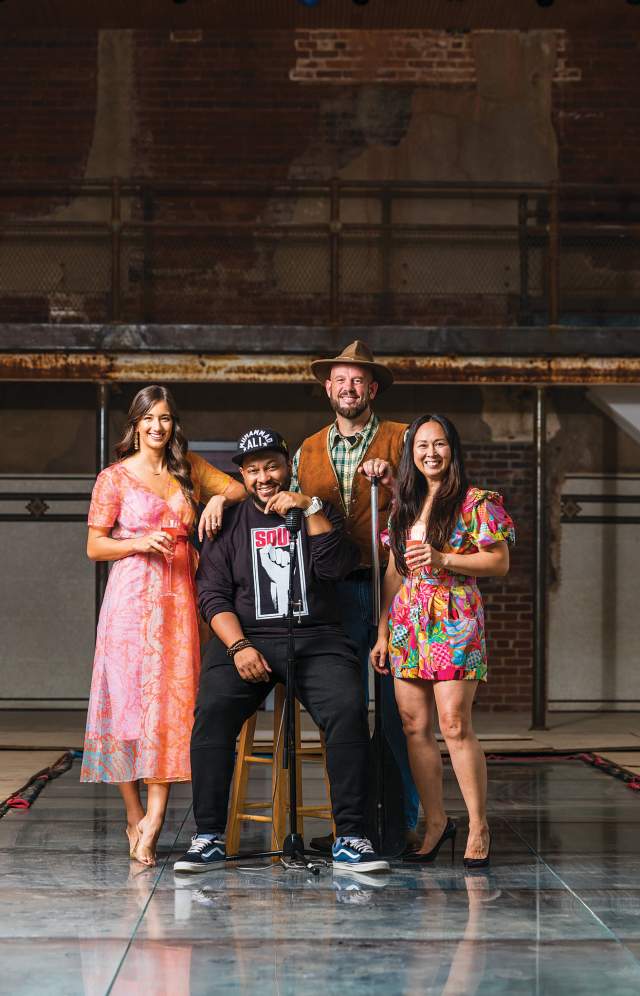 Four people looking at the camera for a group portrait