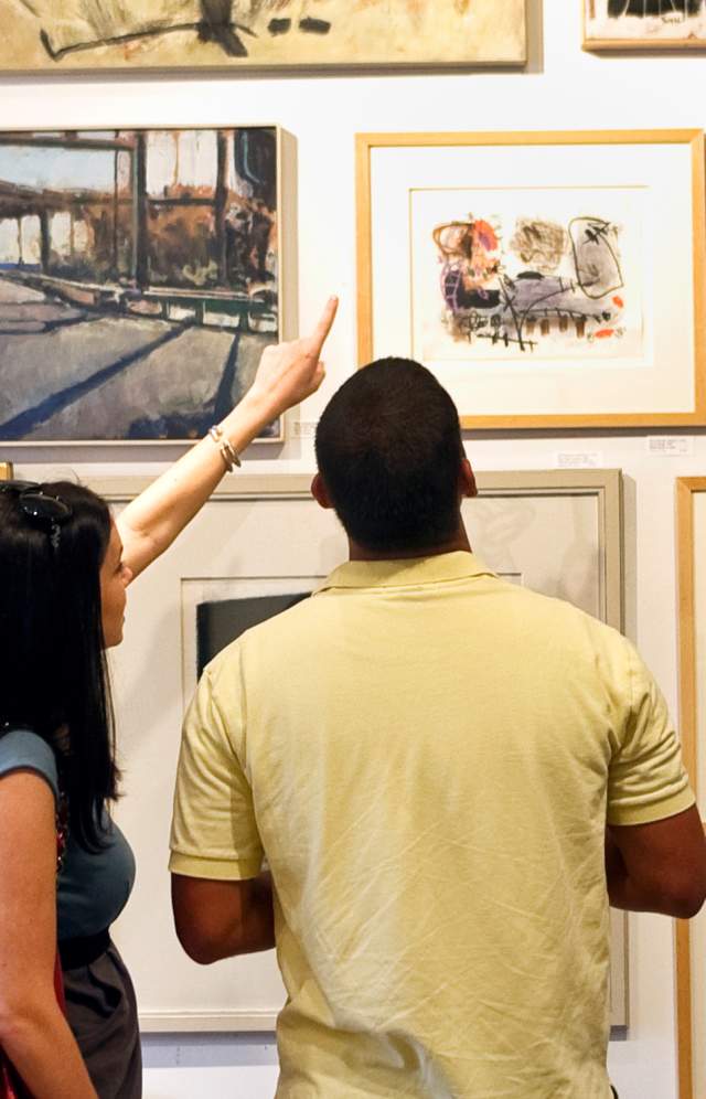 Couple looking at art on a wall