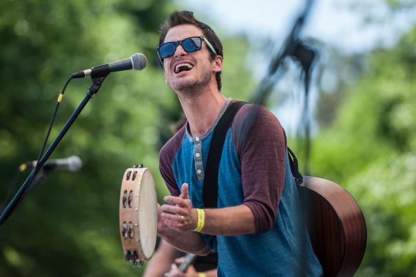 Man playing Tamborine and singing