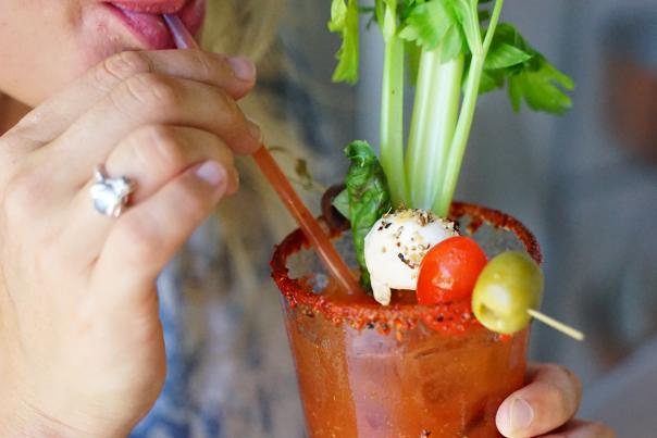 Woman drinking Bloody Mary