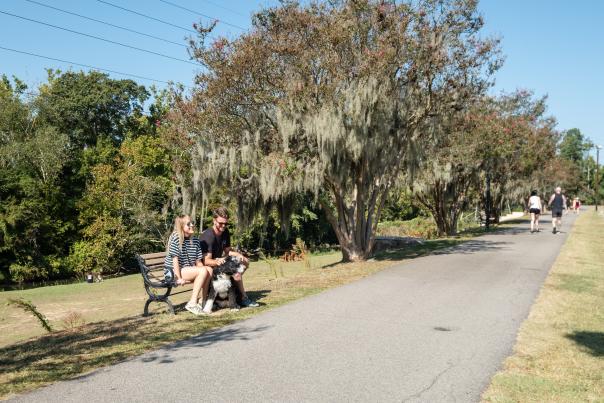 Couple Sitting On A Bench On The Three Rivers Greenway In Columbia, SC