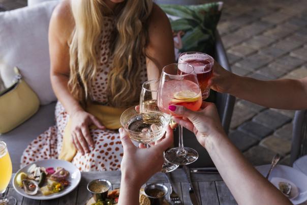 Group of women drinking cocktails at local restaurant in Columbia, SC