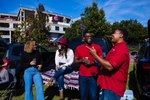 4 friends tailgating outside of Williams Brice Stadium