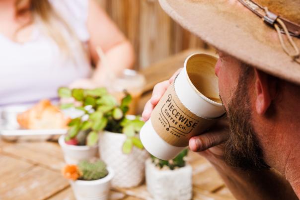People drinking coffee on a patio