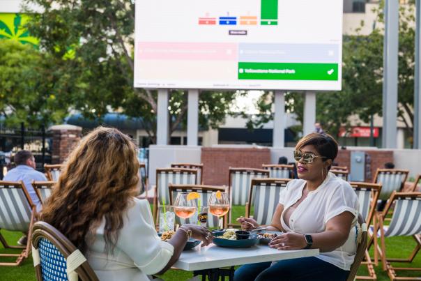 Two women dining during trivia at Market on Main