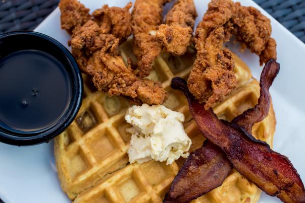 Plate with a waffle, fried chicken and bacon