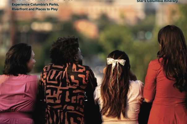 Magazine cover with 4 people looking out over a skyline
