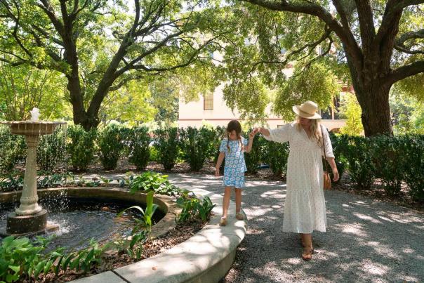 Mother and daughter walking through Historic Columbia Garden