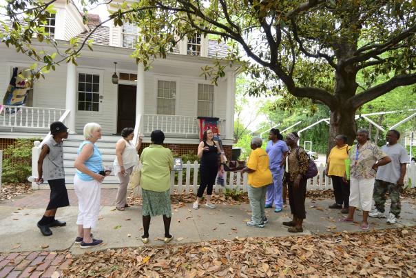 tour in front of Mann-Simons house