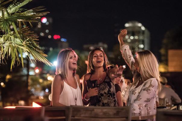 Women dancing on roof in Columbia SC